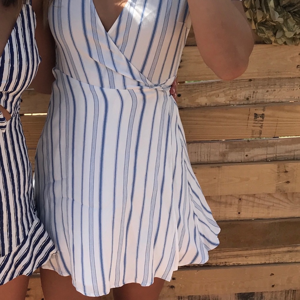 Woman’s white and blue striped cross dress size small